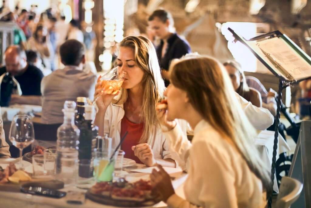 food safety compliance food safety compliance, woman eating and drinking in a restaurant